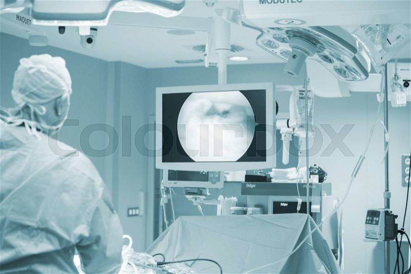 Traumatology orthopedic surgery hospital emergency operating room prepared for arthroscopy operation showing screen to view micro camera images, stock photo