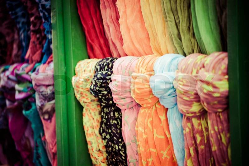 Rows of colourful silk scarfs hanging at a market stall in Istanbul, Turkey , stock photo