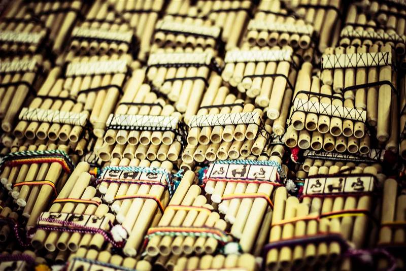 Authentic south american panflutes in local market in Peru, stock photo