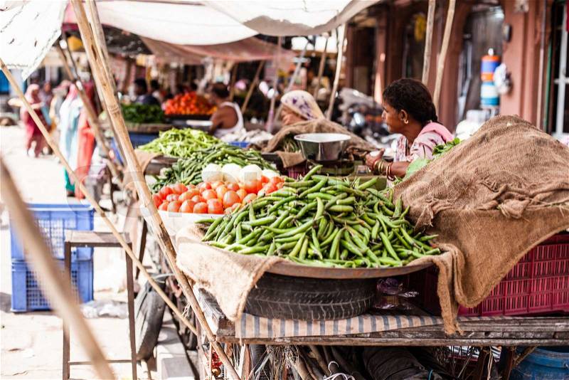 Asian farmer\'s market selling fresh vegetables, stock photo