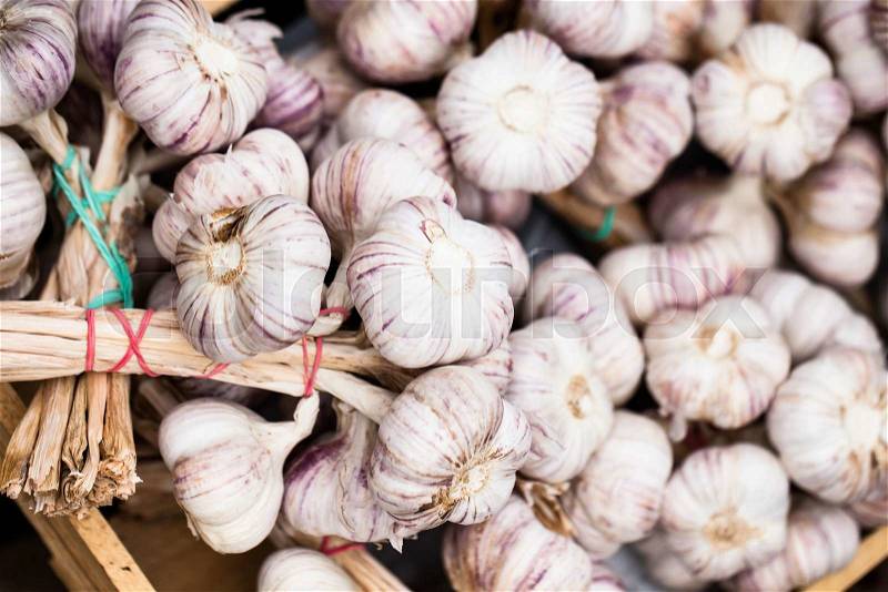 Close up of garlic on market stand , stock photo