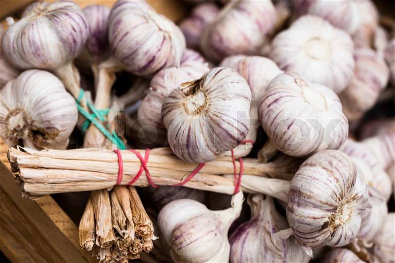Close up of garlic on market stand , stock photo