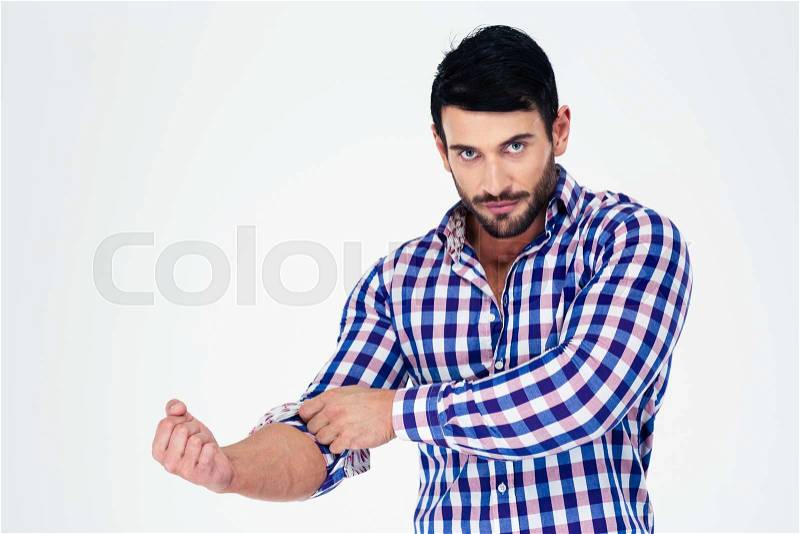 Portrait of a handsome man rolls up his sleeves isolated on a white background, stock photo