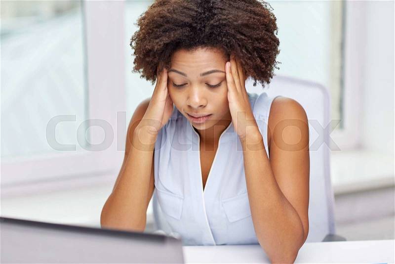 Education, business, fail and technology concept - african american businesswoman or student with laptop computer and papers at office, stock photo