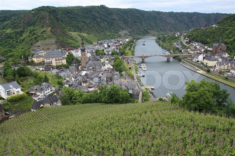 From the top of Reichsburg Cochem you have a wonderful view over the city Cochem and the river Moselle in Germany in spring, stock photo