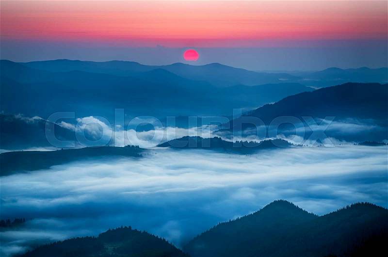 Carpathian mountains summer sunrise vivid landscape with sun and foggy river, travel natural background, stock photo