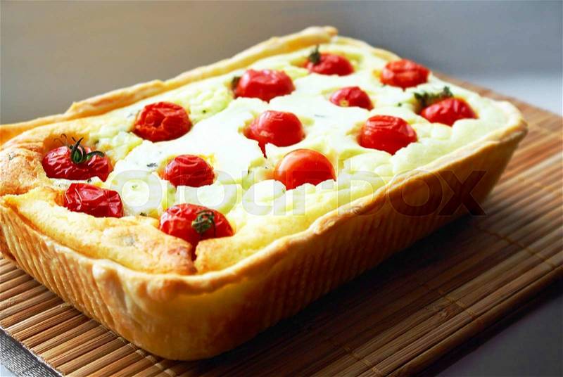 Tasty Baked Pie with Ricotta and Cherry Tomatoes. Studio Photo, stock photo