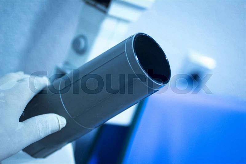 Dental instrumentation dentist xray scan tooth dental tool in the hand of dentist in dentists surgery clinic artistic color photo with shallow depth of focus, stock photo