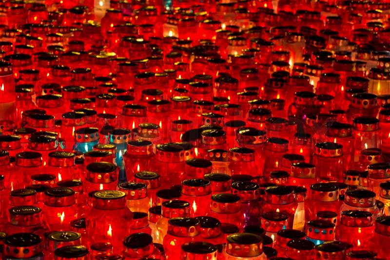 A lot of Candles Burning At a Cemetery During All Saints Day, stock photo