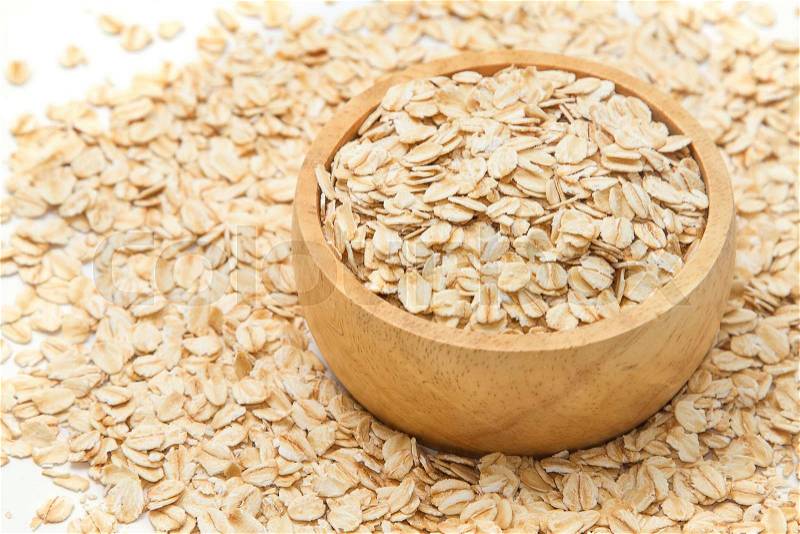 Closeup oats in bowl, on oats background. , stock photo