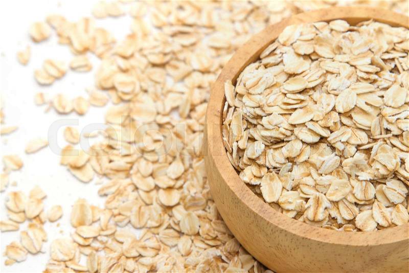 Closeup oats in bowl, on oats background. , stock photo