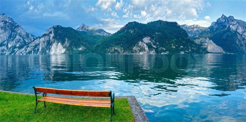 Wooden bench near Traunsee summer lake (Traunkirchen, Austria), stock photo