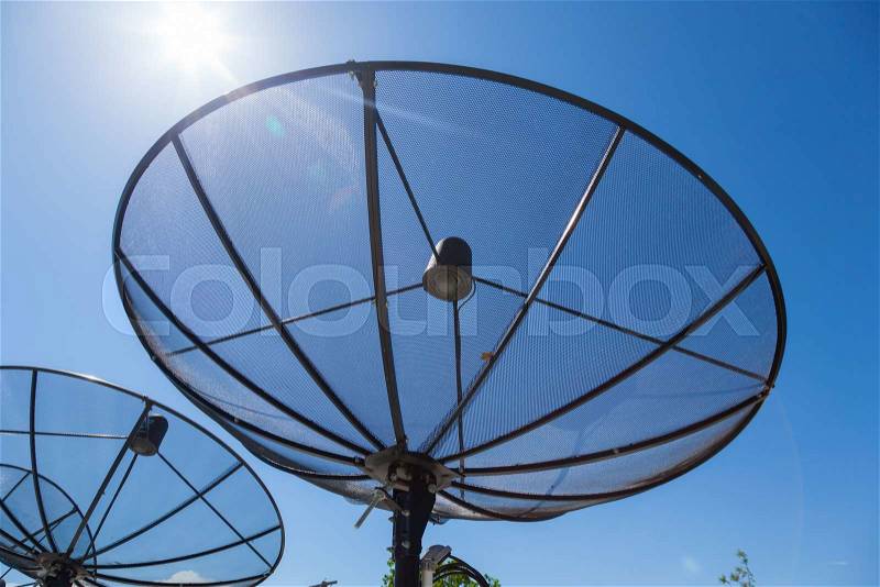 Satellite dishes Mounted on the rooftop of the building. Satellite TV Receiver, stock photo