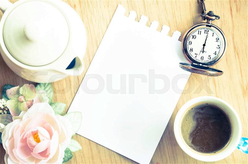 Blank Pad of Paper ready for your own text, pocket watch & Coffee. Vintage style, stock photo