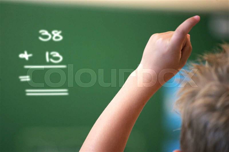 First grade student answering a question, stock photo