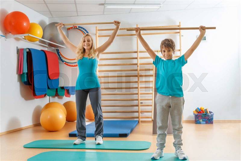 Happy, sports family, mother and son perform gymnastic exercises, stock photo