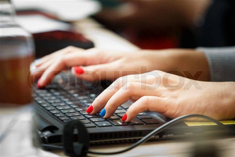 Close up fingers typing on keyboard, business or communication concept, stock photo