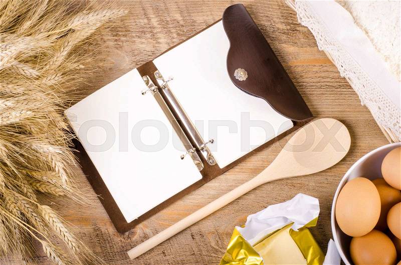 Baking background with ears of wheat, flour, eggs and butter. , stock photo