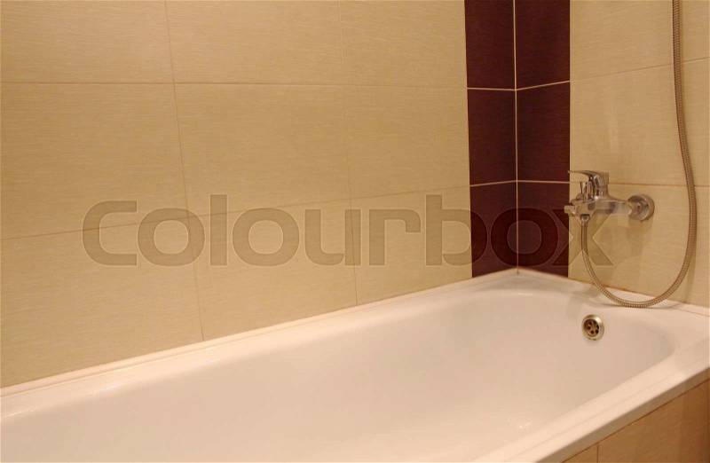 Bath tub detail with chrome faucet, stock photo