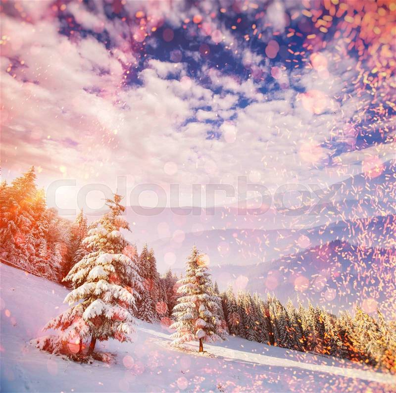 Fabulous winter landscape in the mountains, background with some soft highlights and snow flakes, stock photo