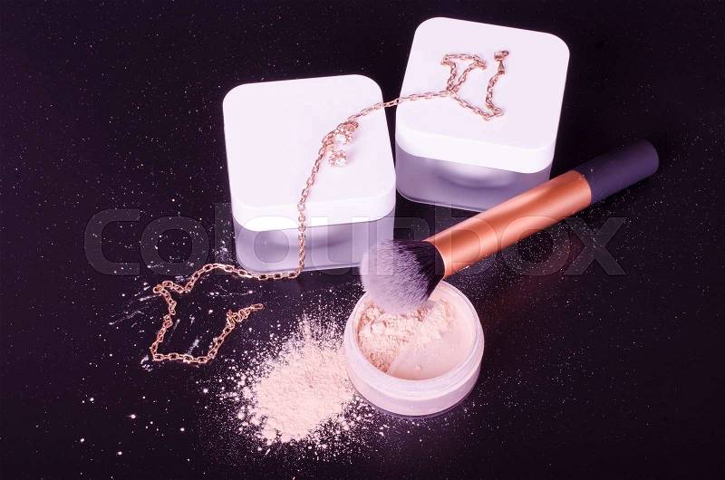 Face powder, brush, night and day creams, stock photo
