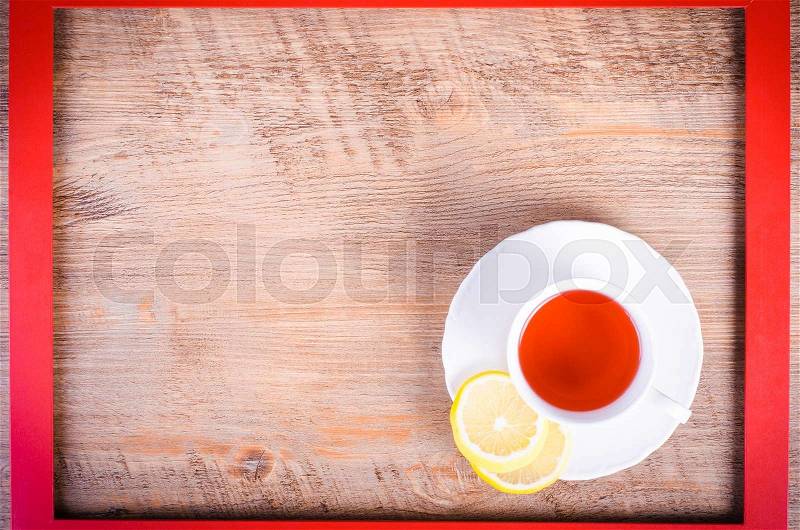 Winter pomegranate and hibiscus drink in red frame. Free space for text, stock photo
