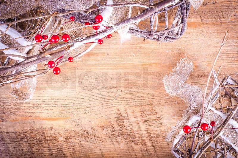 Christmas rustic light boxes on wooden background, snowy wreath. Christmas and New Year decoration frame. Free space for text, stock photo