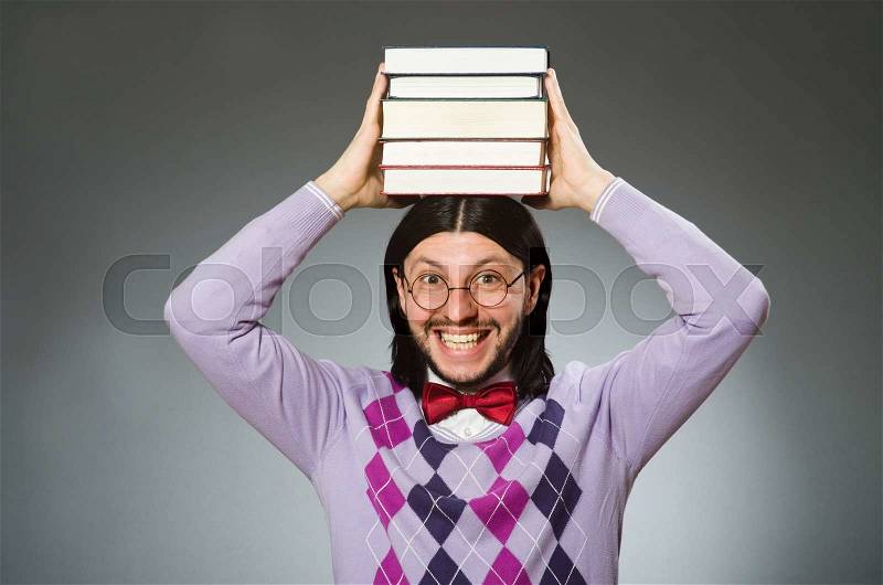 Young student with book in learning concept, stock photo