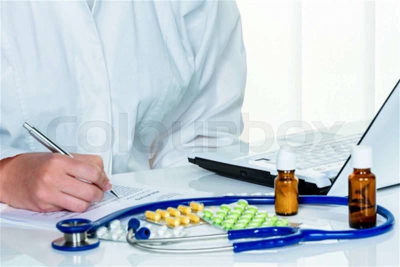 A young female doctor prescribes medication. prescription pills are prescribed by a doctor, stock photo