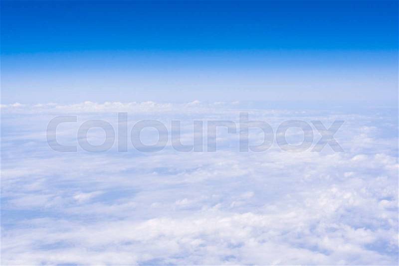 Skyline View above the Clouds from air plane. Sky background, stock photo