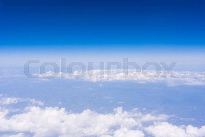 Skyline View above the Clouds from air plane. Sky background, stock photo