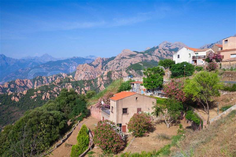 Rural landscape, small living houses in mountains. Piana, South Corsica, France, stock photo