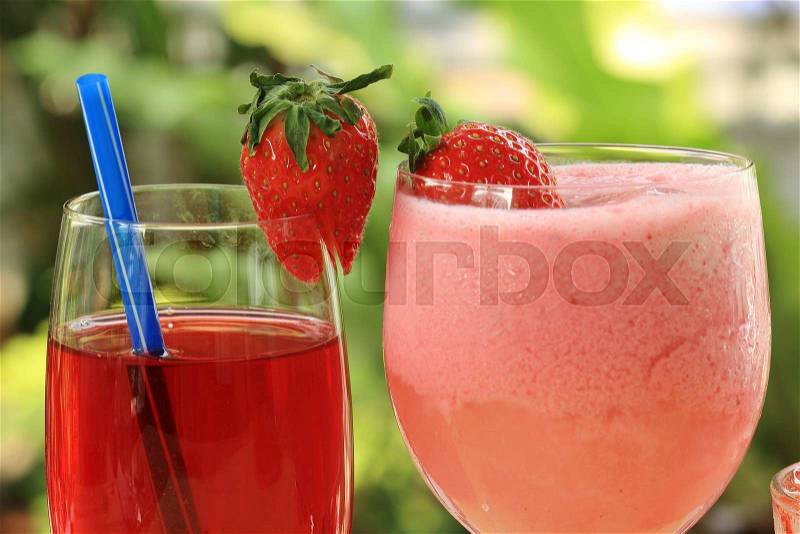 Refreshing Strawberry juice and smoothie on the table, stock photo