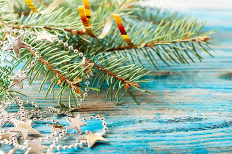 Christmas background with silver decorations and fir branch, stock photo