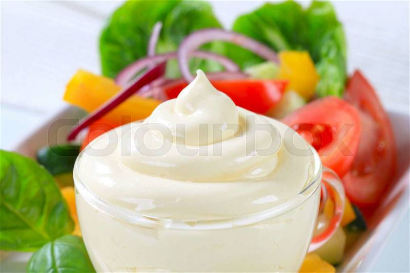 Fresh vegetable salad with salad dressing, stock photo