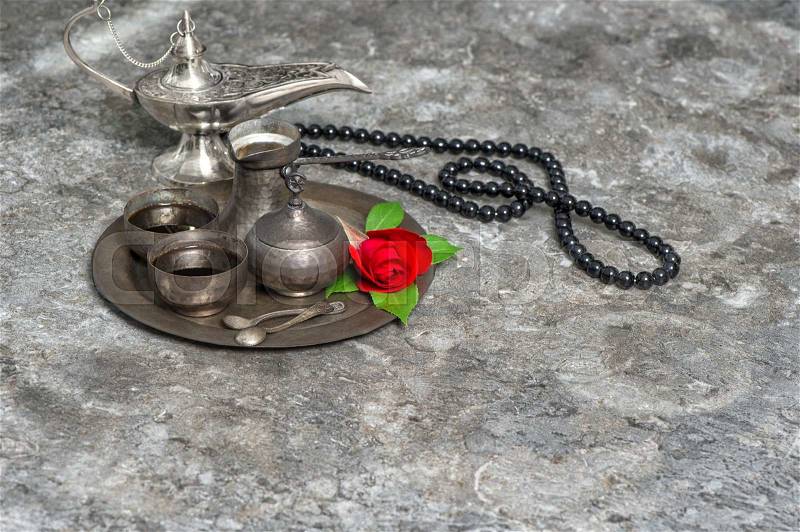 Moroccan coffee and red rose flower, arabian lantern and rosary. Islamic holidays decoration. Ramadan kareem. Eid mubarak. Oriental hospitality concept. , stock photo