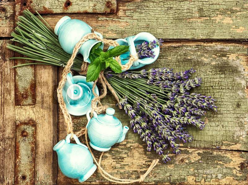 Lavender flowers over rustic wooden background. Shabby chic. Vibrant colors, stock photo
