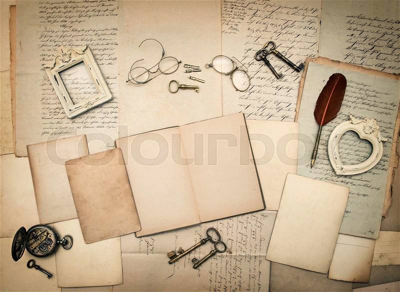 Old letters and photo frames. Vintage things, handwritten documents, open book. Nostalgic sentimental paper background, stock photo