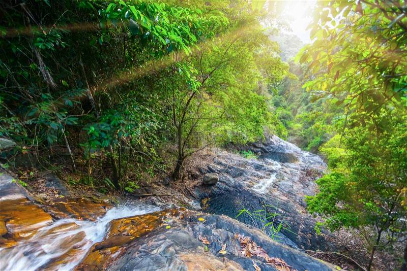 River and rocks in mountains under sunshine in Thailand, stock photo