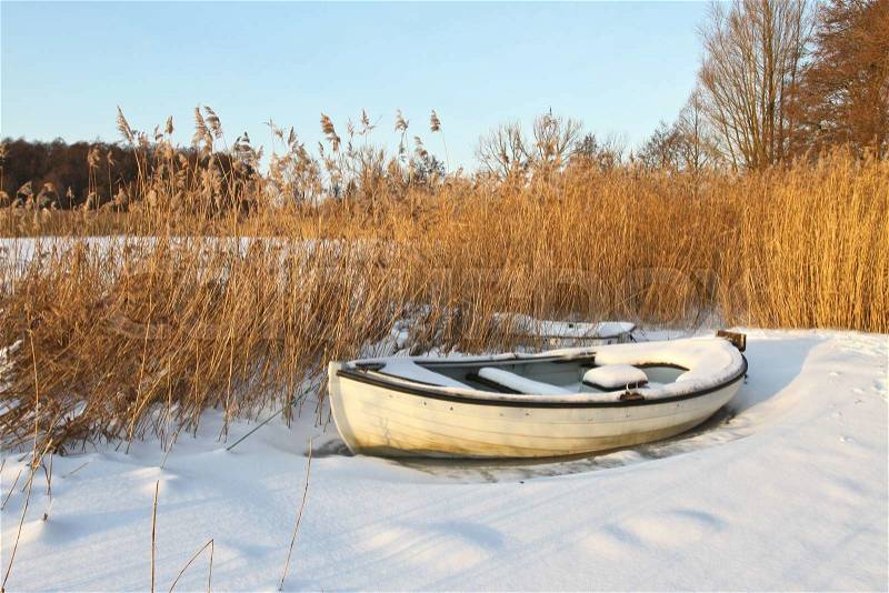 Boats at the lake in winter in Denmark, stock photo