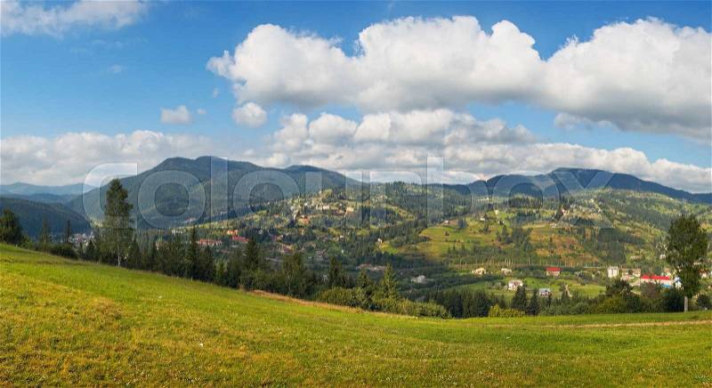 Summer view of mountain village outscirts (Slavske village, Ukraine, Carpathian Mts), stock photo