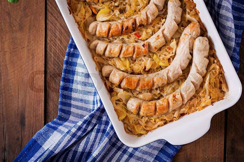 Munich sausages with fried cabbage. Top view, stock photo