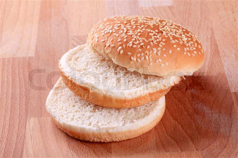 Slices of sesame seed bun - ready for hamburger, stock photo