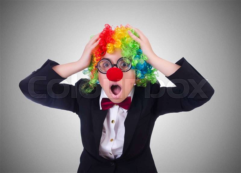 Woman clown businesswoman isolated on white, stock photo