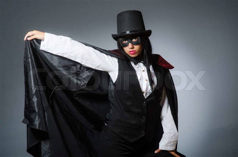 Woman magician in funny concept, stock photo