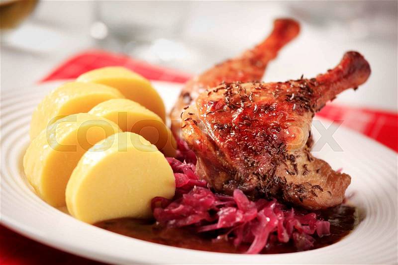 Roast Duck Legs with Red Cabbage and Potato Dumplings, stock photo