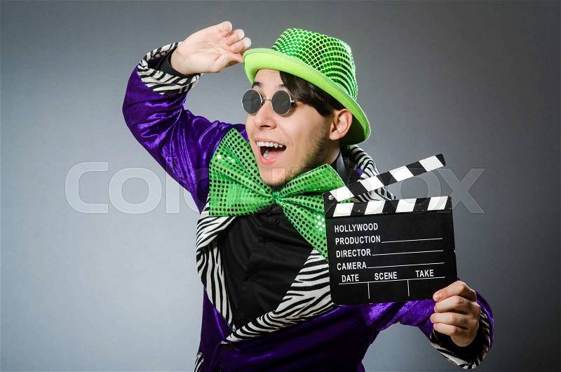 Funny man with movie clapboard, stock photo