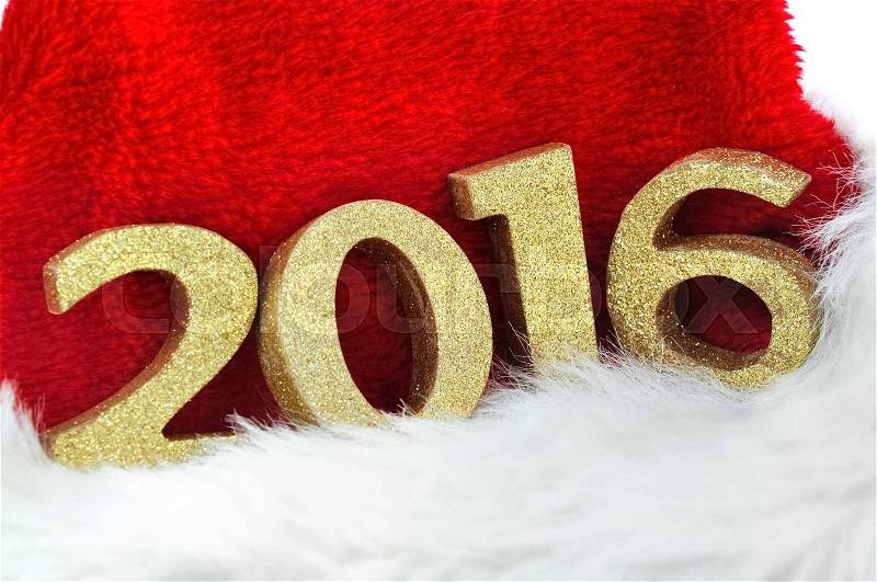 Close on golden figures 2016 on a santa claus hat on white background, stock photo