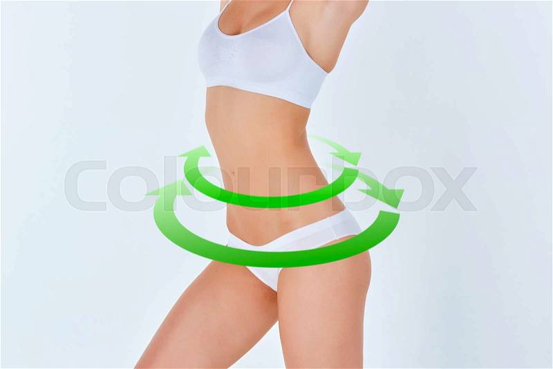 Female body with the green drawing arrows Plastic surgery, healthy nutrition, liposuction, sport and cellulite removal concept, stock photo