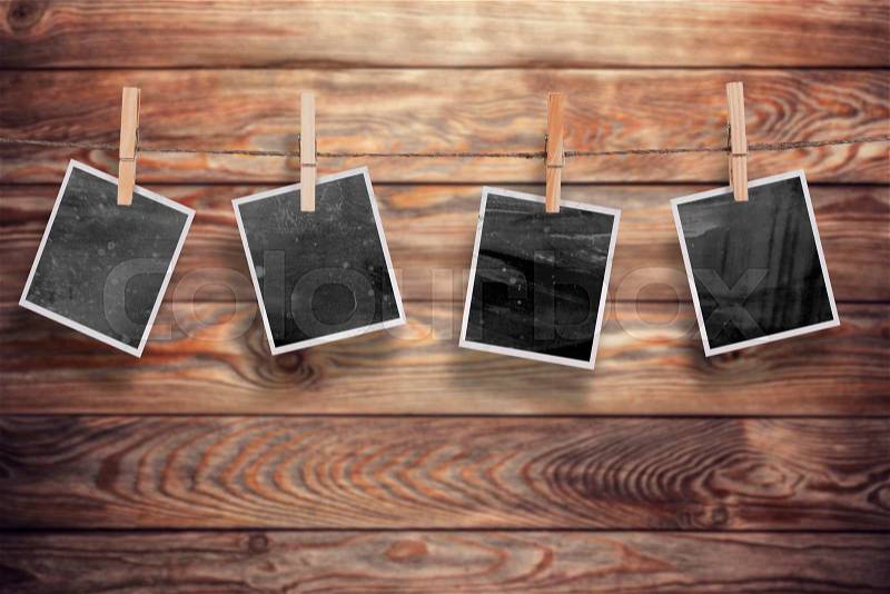 Aged old photo frames on a wooden background, stock photo